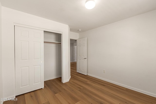 10212 E Caballero St, Mesa, AZ 85207 - unfurnished bedroom featuring wood finished floors and a closet