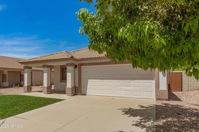 10212 E Caballero St, Mesa, AZ 85207 - view of front of house with driveway, stucco siding, an attached garage, and a tiled roof