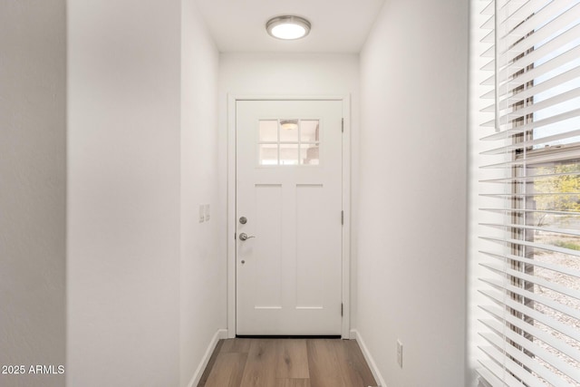 10212 E Caballero St, Mesa, AZ 85207 - doorway to outside featuring light wood-style floors and baseboards