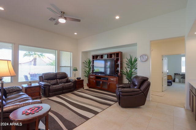 tiled living room featuring ceiling fan