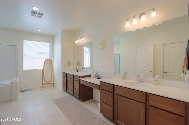 bathroom featuring tile floors, plenty of natural light, and vanity