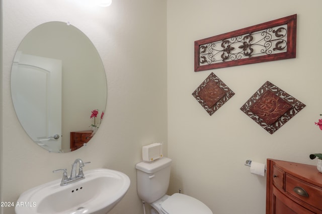 bathroom with sink and toilet