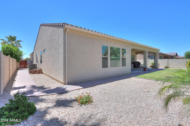 back of property featuring a patio