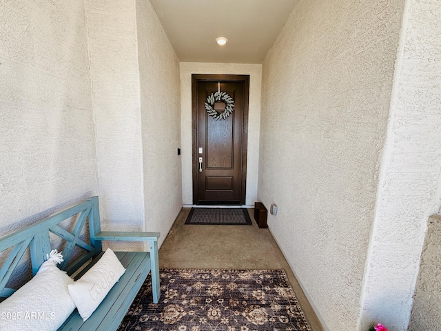 doorway to property with stucco siding