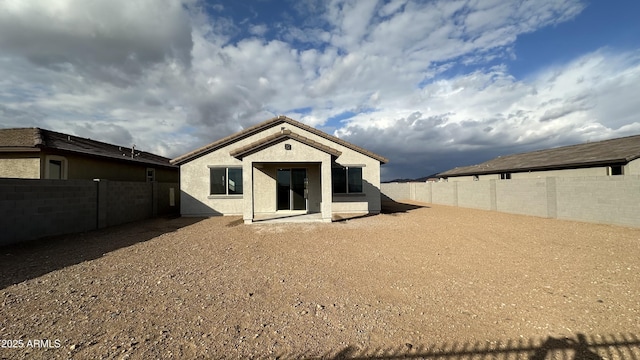 back of house featuring a patio area