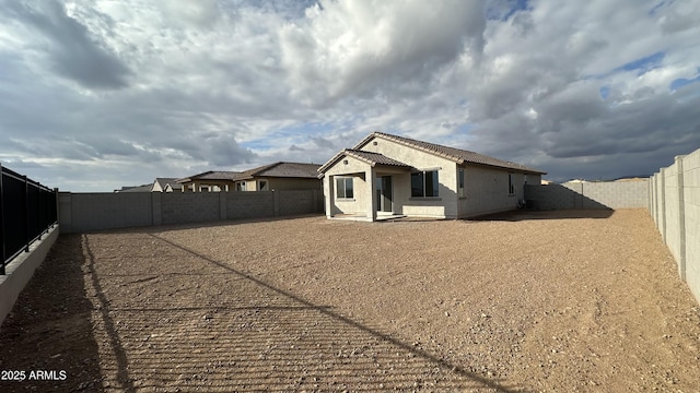 back of house with a patio