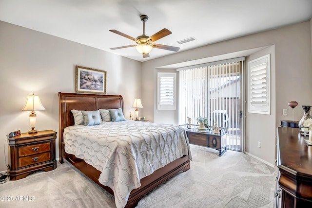 bedroom with ceiling fan, access to outside, and light colored carpet