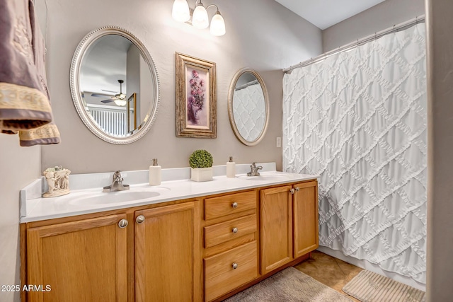 bathroom featuring tile patterned floors, vanity, a shower with shower curtain, and ceiling fan