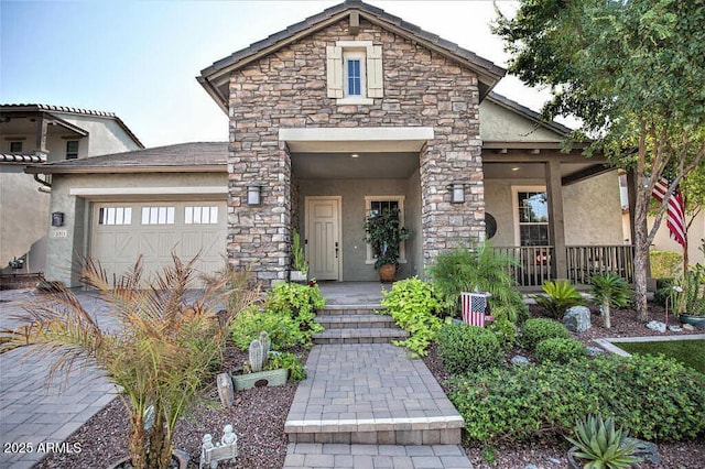 view of front of home featuring a garage and a porch