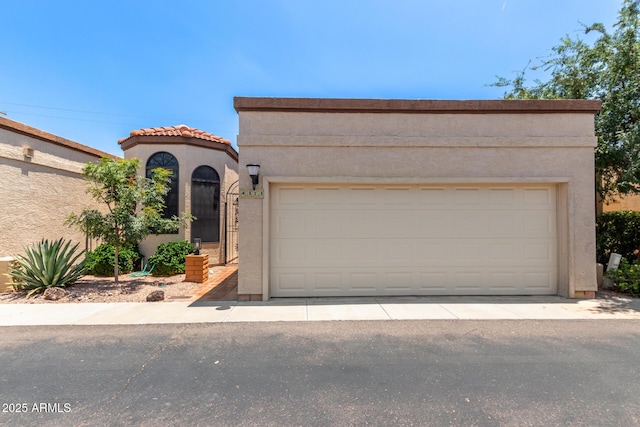 4313 N 29th Way, Phoenix, AZ 85016 - mediterranean / spanish home featuring stucco siding, a garage, and a tile roof