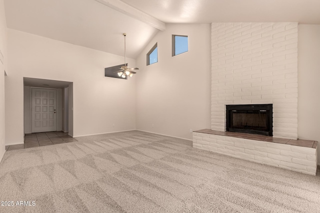4313 N 29th Way, Phoenix, AZ 85016 - unfurnished living room featuring carpet flooring, beam ceiling, a brick fireplace, ceiling fan, and high vaulted ceiling