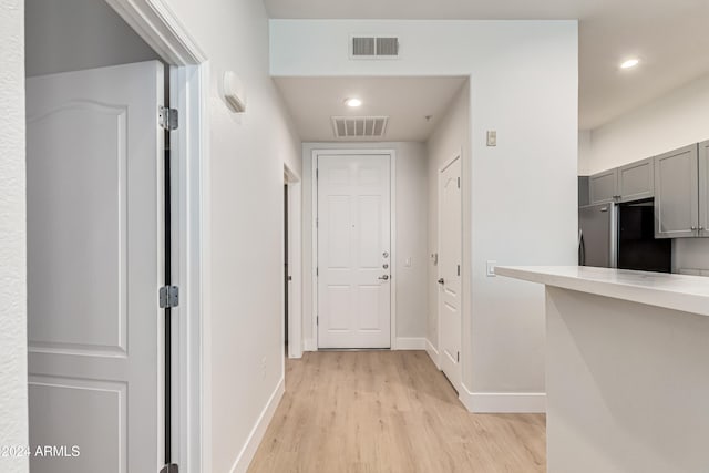 hall with light hardwood / wood-style flooring