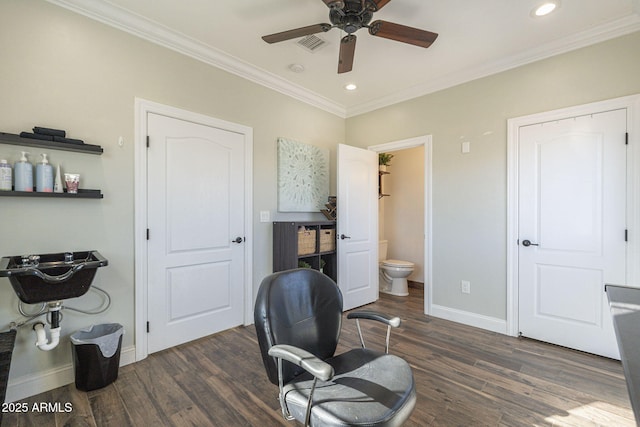 office featuring ceiling fan, ornamental molding, and dark hardwood / wood-style flooring