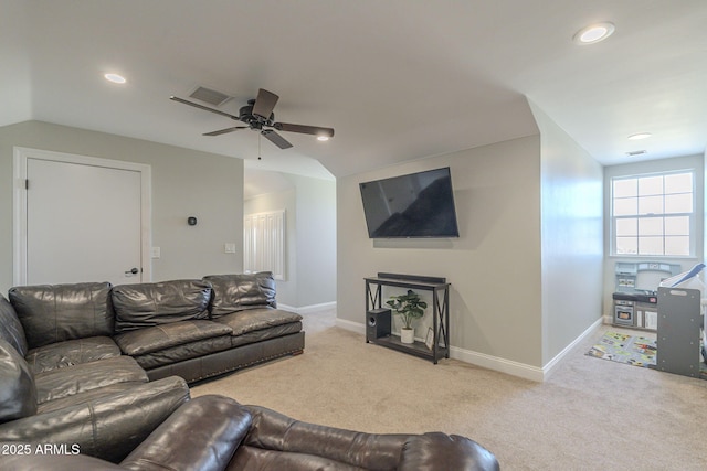 carpeted living room featuring vaulted ceiling and ceiling fan