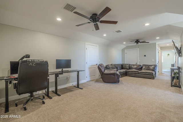 carpeted office space with ceiling fan and vaulted ceiling