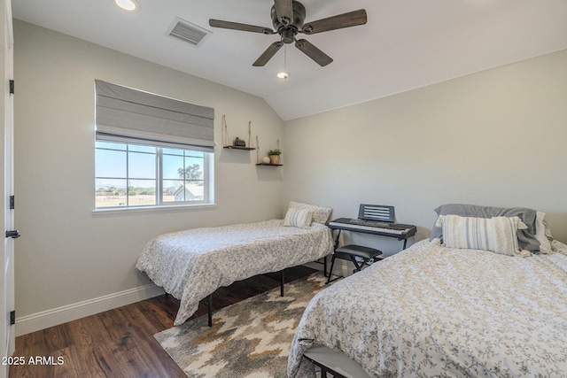 bedroom featuring ceiling fan, vaulted ceiling, and dark wood-type flooring