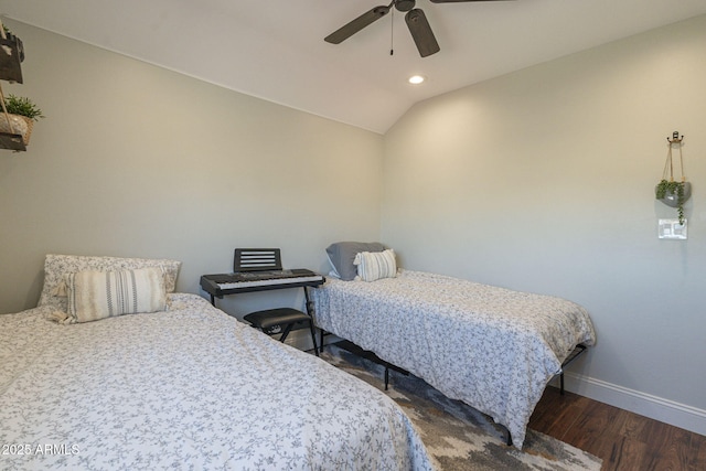 bedroom with vaulted ceiling, ceiling fan, and dark hardwood / wood-style floors