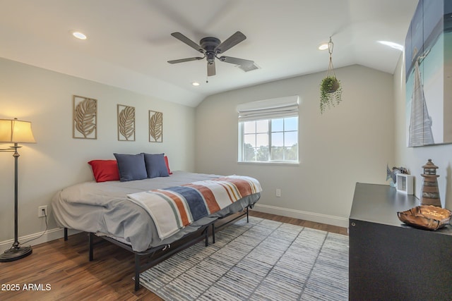 bedroom with vaulted ceiling, ceiling fan, and wood-type flooring