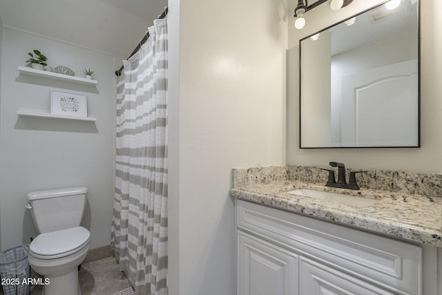 bathroom with a shower with shower curtain, vanity, and toilet