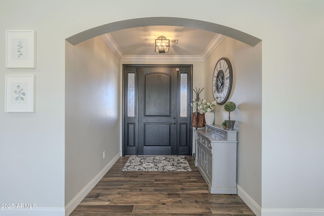 entryway featuring dark wood-type flooring and ornamental molding