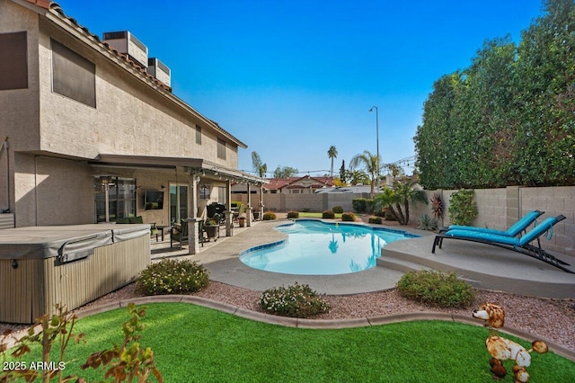 view of swimming pool featuring a hot tub, cooling unit, and a patio area