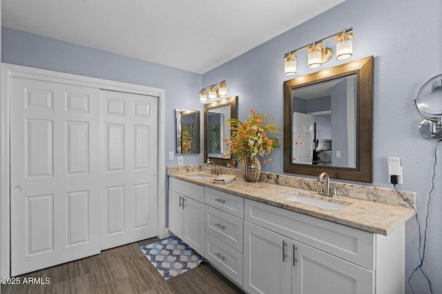 bathroom featuring vanity and hardwood / wood-style flooring