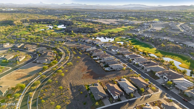 birds eye view of property featuring a water and mountain view