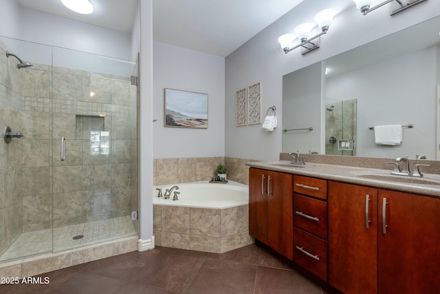 bathroom featuring a garden tub, a stall shower, tile patterned flooring, and a sink