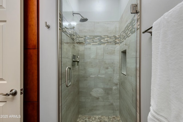 bathroom with a shower stall