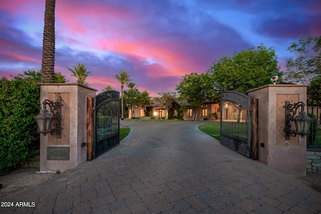 view of gate at dusk