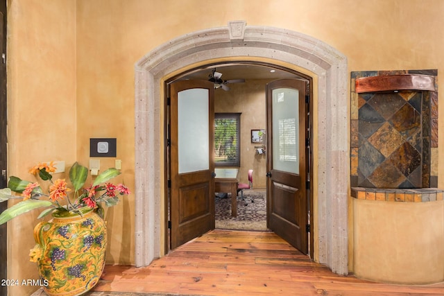 hallway with hardwood / wood-style floors