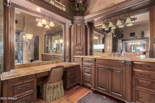 bathroom with hardwood / wood-style floors and vanity