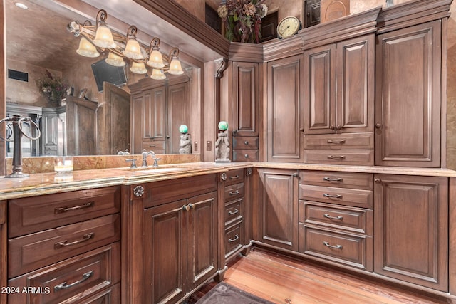 bathroom featuring vanity and hardwood / wood-style flooring