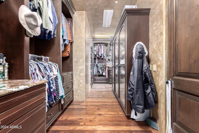 spacious closet featuring light wood-type flooring