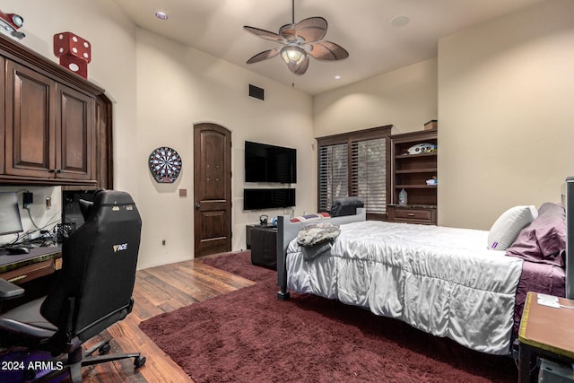 bedroom featuring wood-type flooring and ceiling fan