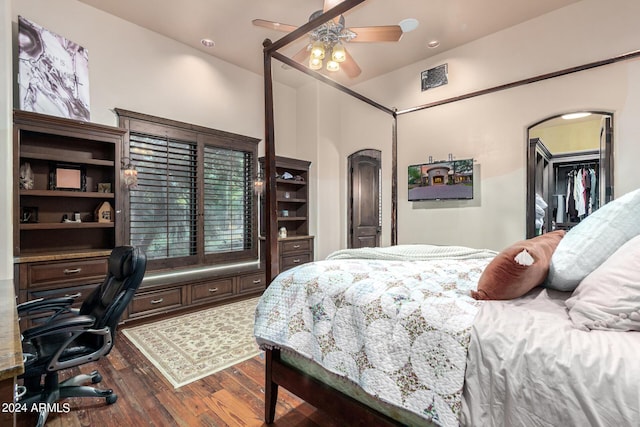 bedroom featuring a closet, hardwood / wood-style flooring, and ceiling fan