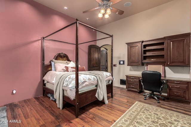 bedroom with ceiling fan and dark hardwood / wood-style floors