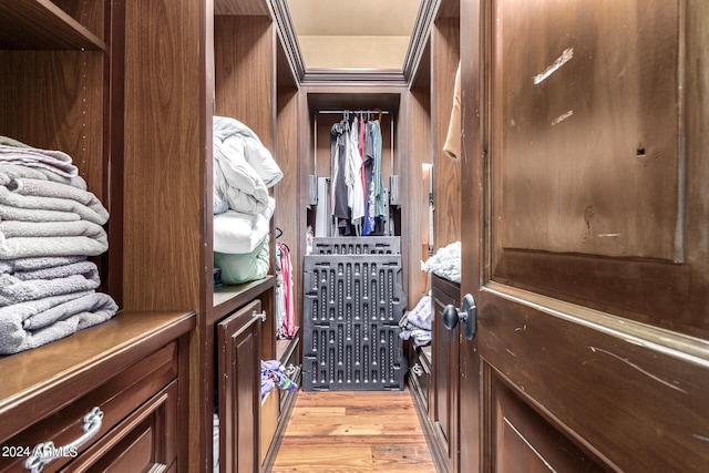 spacious closet with light hardwood / wood-style flooring