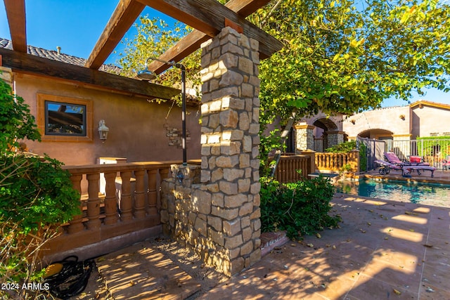 view of side of property with a patio area