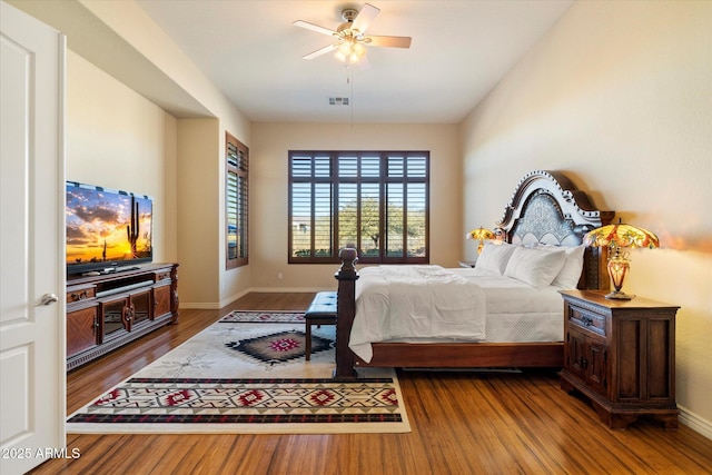 bedroom featuring hardwood / wood-style floors and ceiling fan