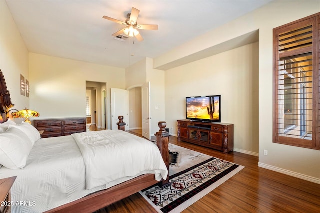 bedroom with ceiling fan and dark hardwood / wood-style floors