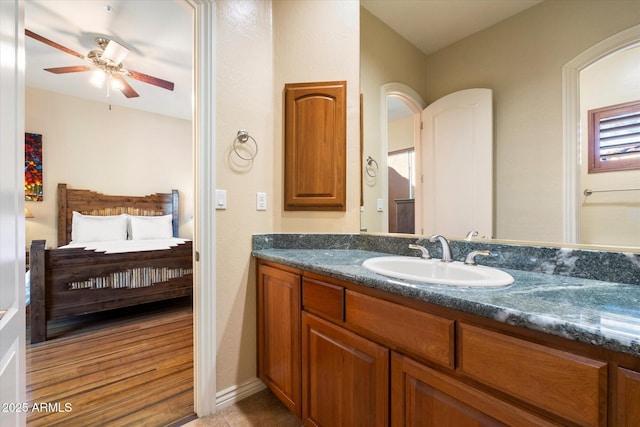 bathroom featuring ceiling fan and vanity