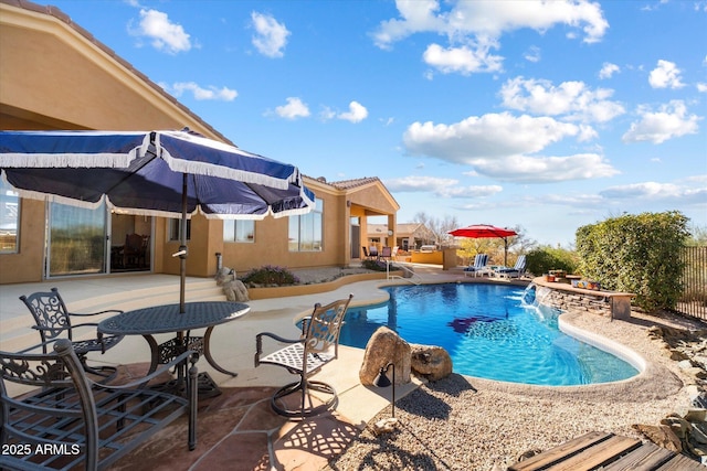 view of swimming pool featuring a patio