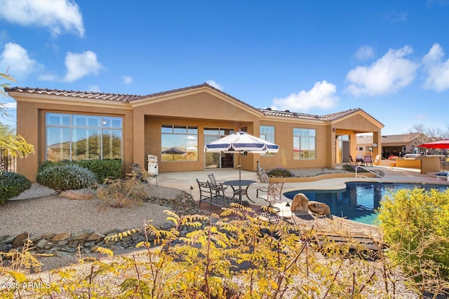 rear view of house with a patio area