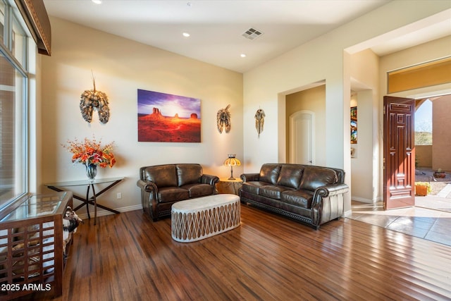 living room featuring dark wood-type flooring