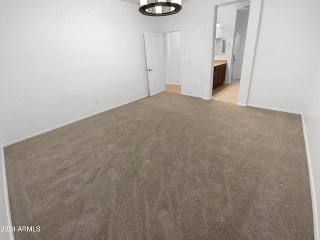 empty room featuring light carpet