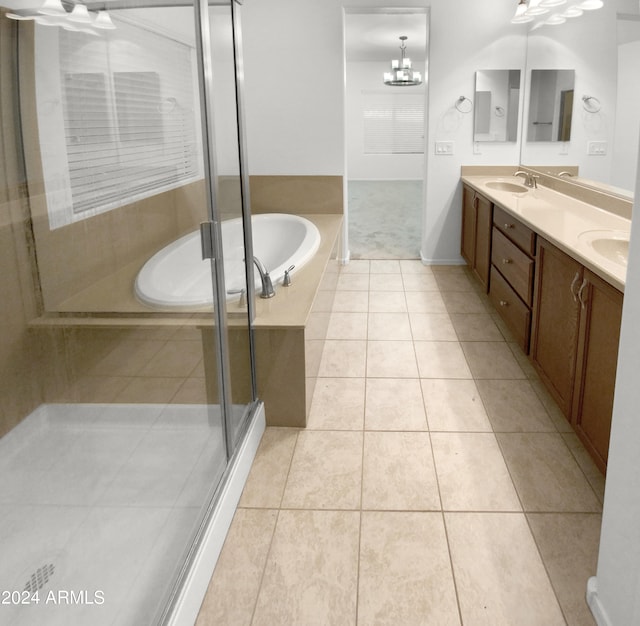 bathroom with vanity, a chandelier, tile patterned floors, and shower with separate bathtub