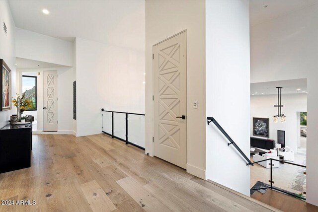 sitting room featuring light wood-type flooring and a mountain view