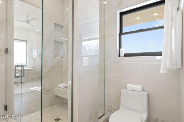 bathroom featuring ceiling fan, vanity, hardwood / wood-style floors, and a shower with door