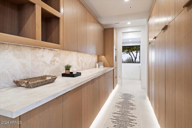 home office featuring light hardwood / wood-style floors and ceiling fan